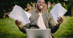 student holding documents